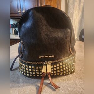 Michael Kors studded backpack purse. Slight wear. See pics. Medium size.